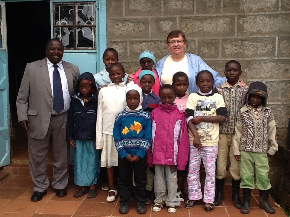 Marion Grant with Kenyan children and pastor