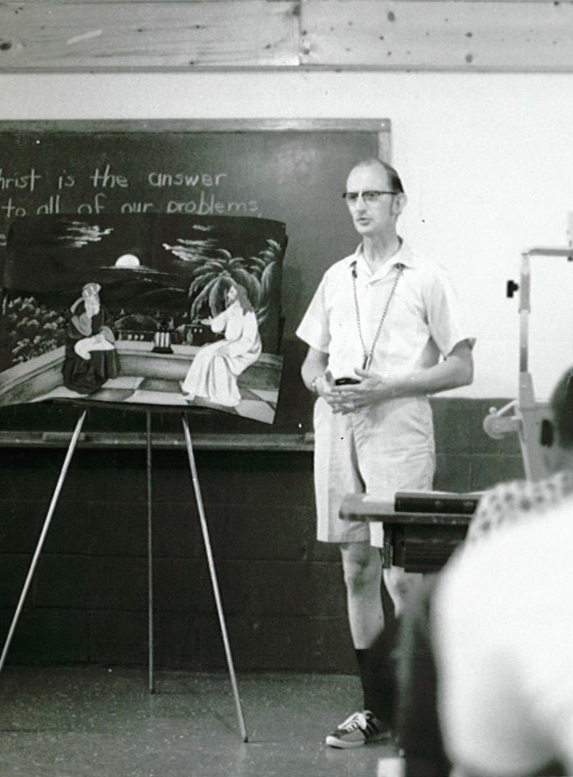 Young Dave Haas teaching at camp