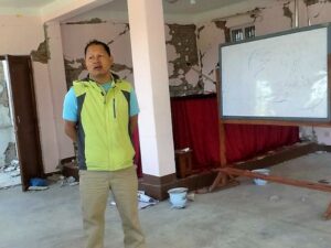 BCM Nepal director Robbin Vaidhya in damaged BCM church