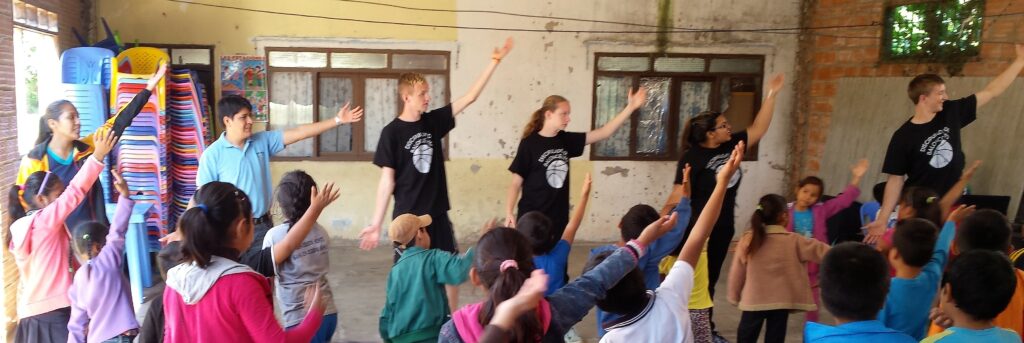 Basketball discipleship-team and local Christian youth lead Bible club worship