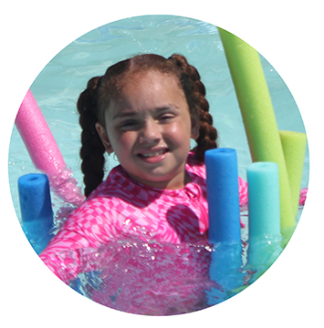 CortlandPoolCircle camper swimming with pool noodles
