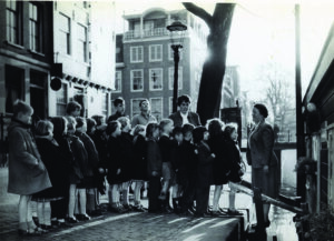 Children line up to board a houseboat for Bible club in the Netherlands