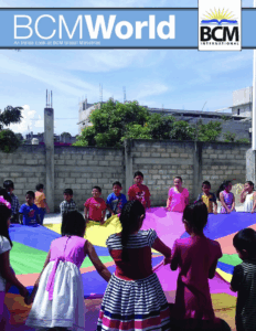 kids playing with a parachute tarp game