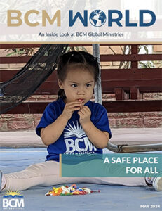 Girl wearing a BCM shirt eating candy