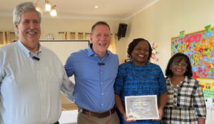 Pauline stands with BCM leaders to welcome her to her new role.